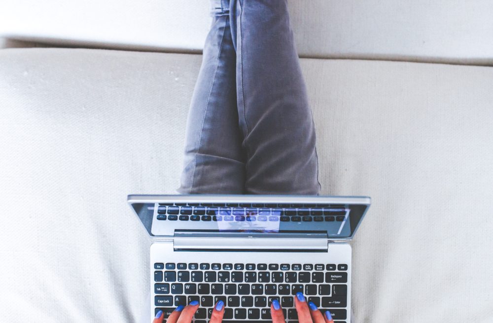 Lady working on laptop | Start your blog with WordPress and Bluehost