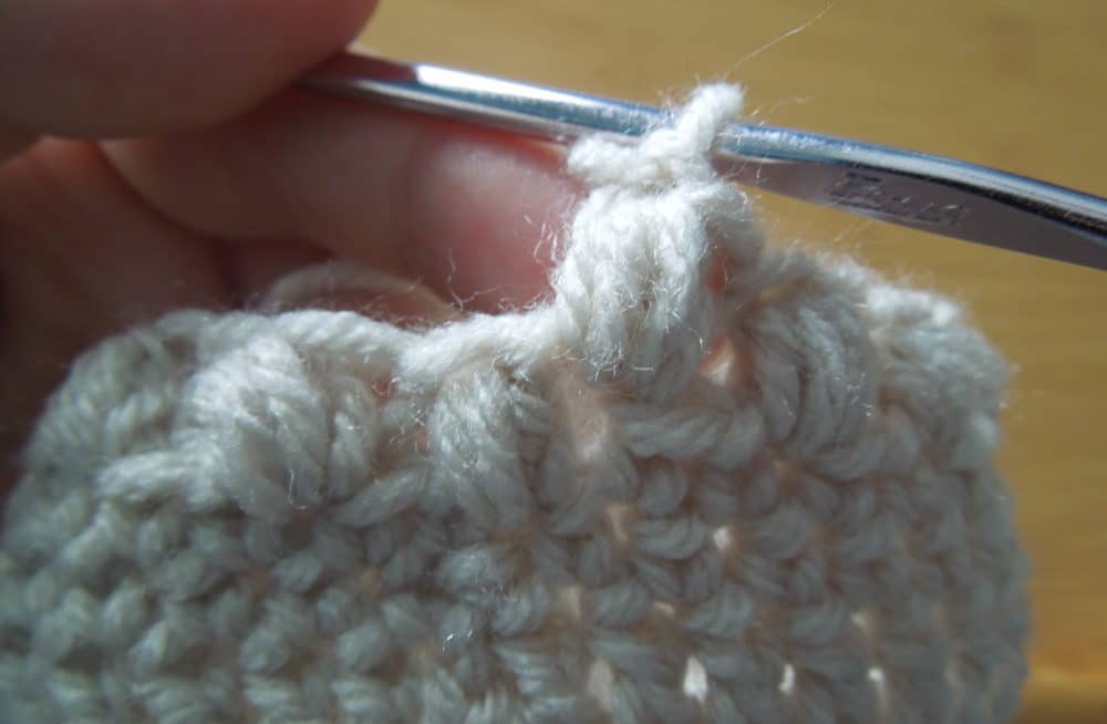 Baby Bean Hat Close Up first bean stitch of row 11