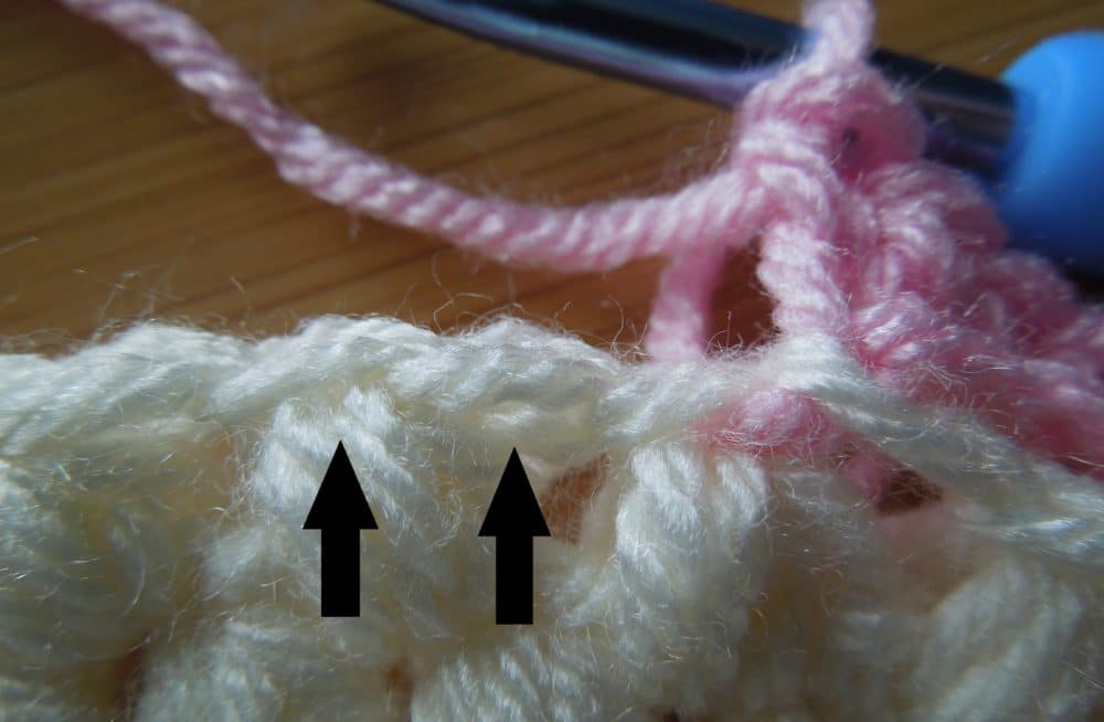 Slip stitch into the loop on the right first, then slip stitch into the next loop