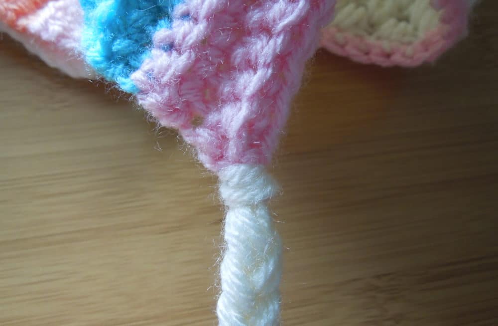 Attach your braid yarn at the corner of the brim.