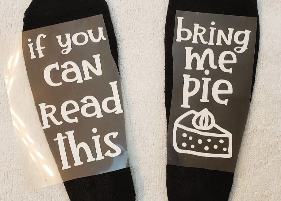 Positioning the vinyl on the socks