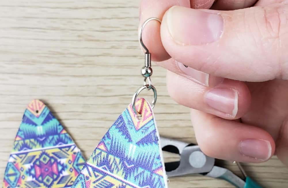 Earring with hardware attached