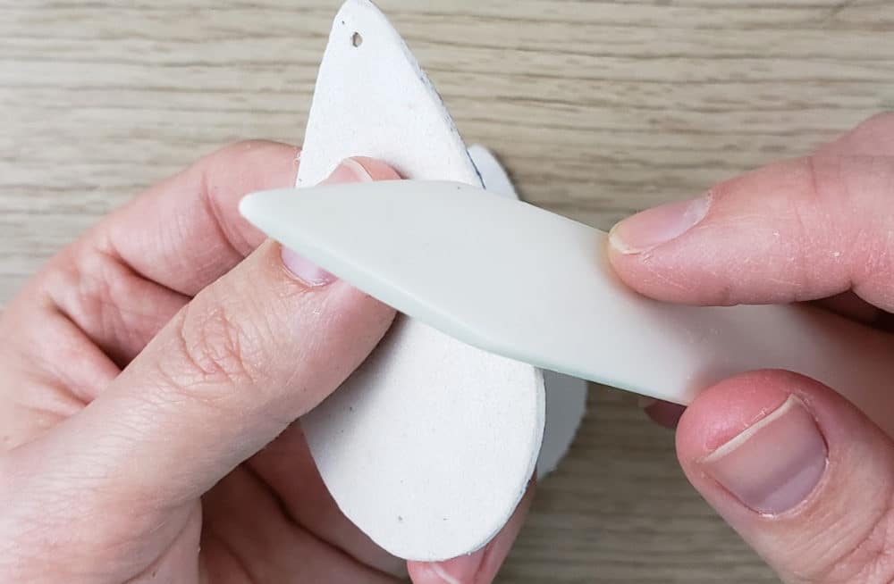 burnishing the sides of leather earrings