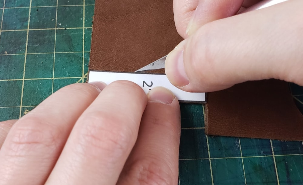 Cutting out the leather earring