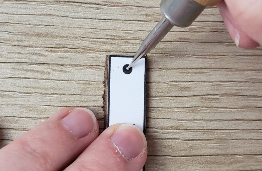 Marking where to punch the hole for leather earrings