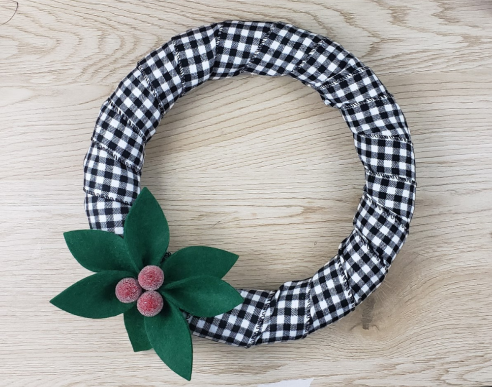 Add the holly and berries to the wreath