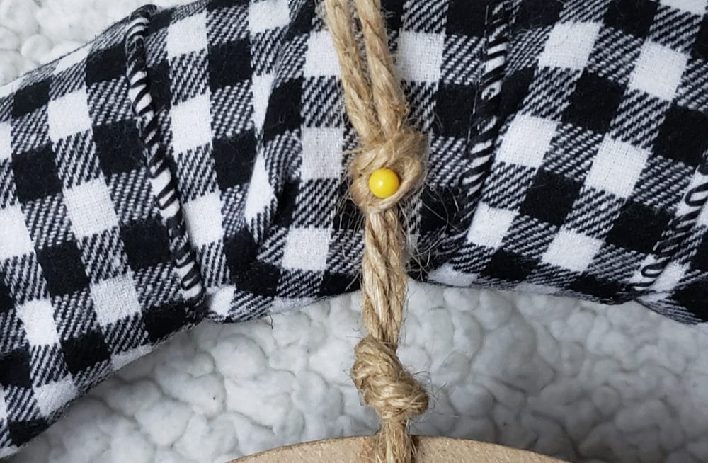 Pin the jute to the back | DIY Christmas wreath