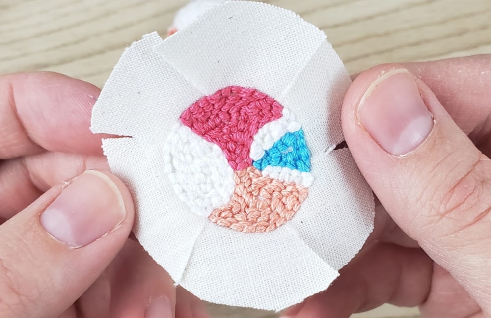 After cutting all the slits into the border | DIY Punch Needle Earrings