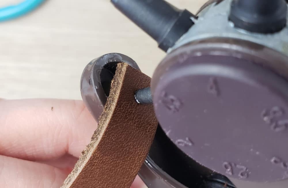 punching hole in leather earring