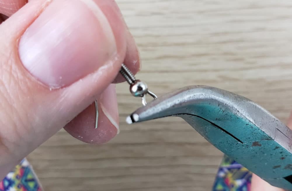 Twisting earring hook hole around