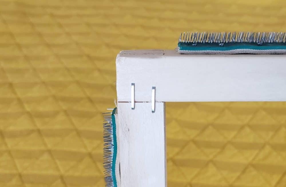 Staples on back of canvas stretcher bars