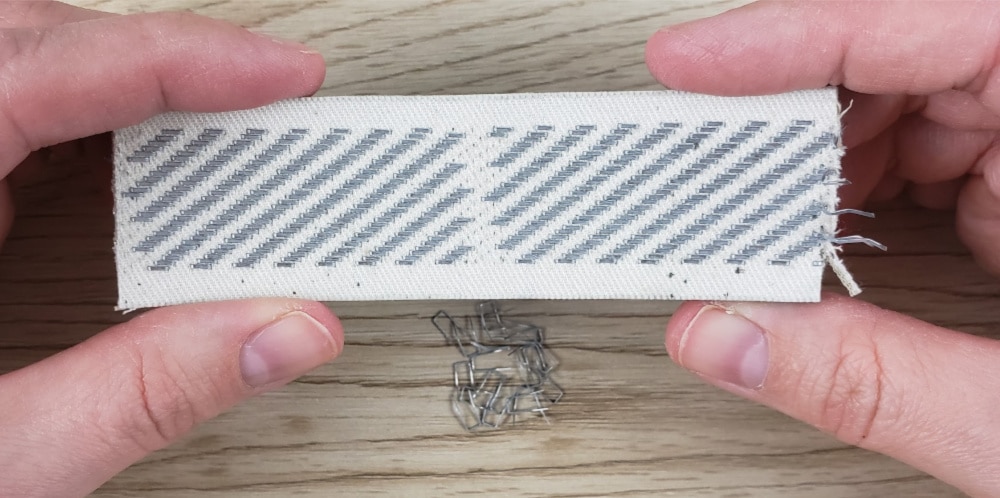 Row of staples removed from gripper strip