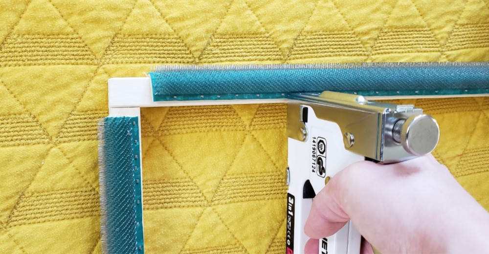 Staple gripper strip to frame