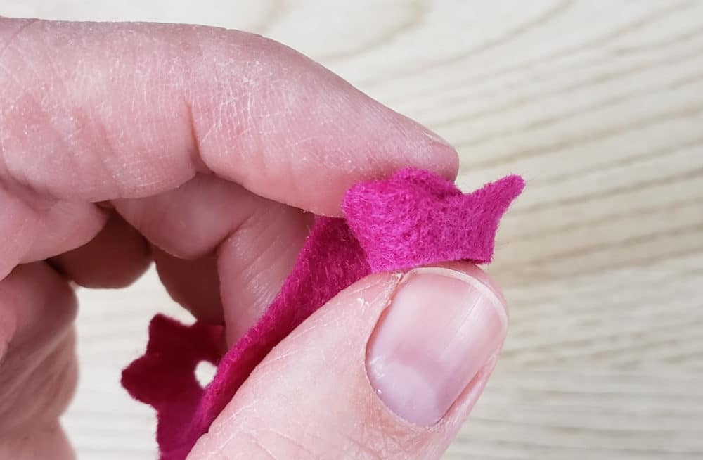 Keep the bottom edge lined up on your felt flower earrings