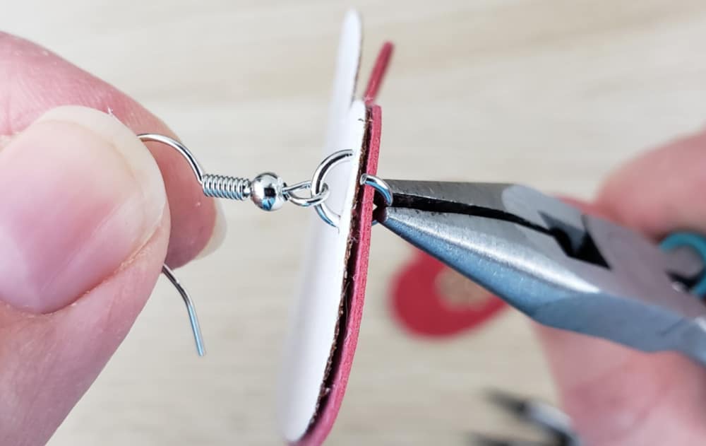 Thread the jump ring through faux leather earrings and earring hook