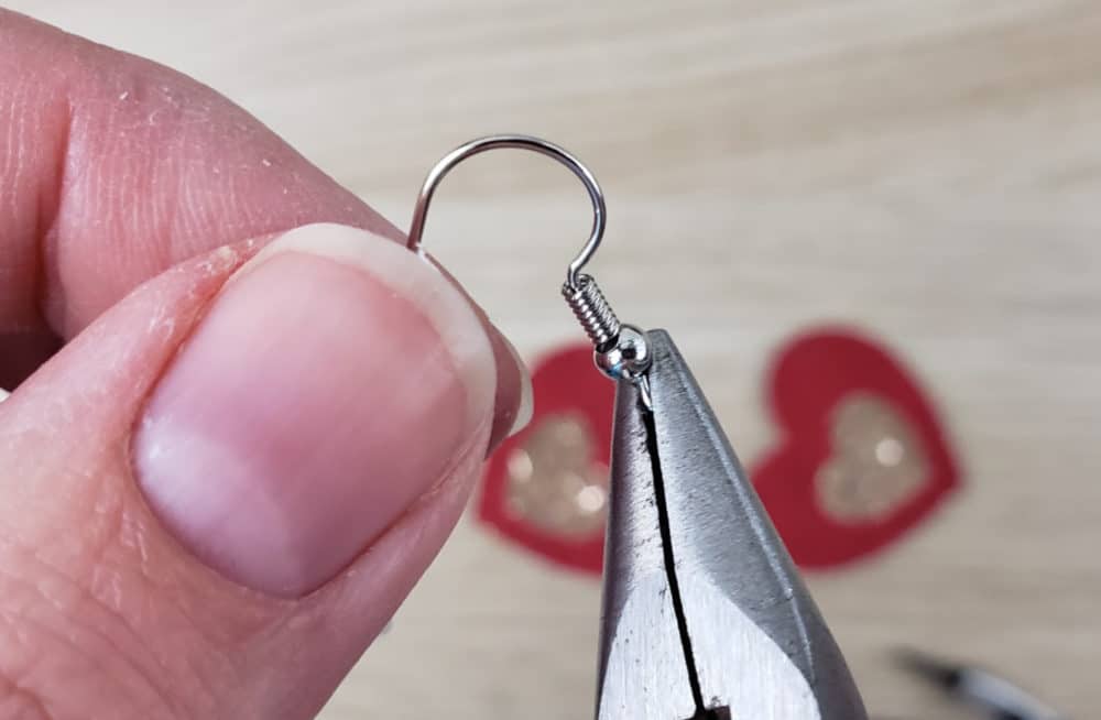 twist the earring hook loop around