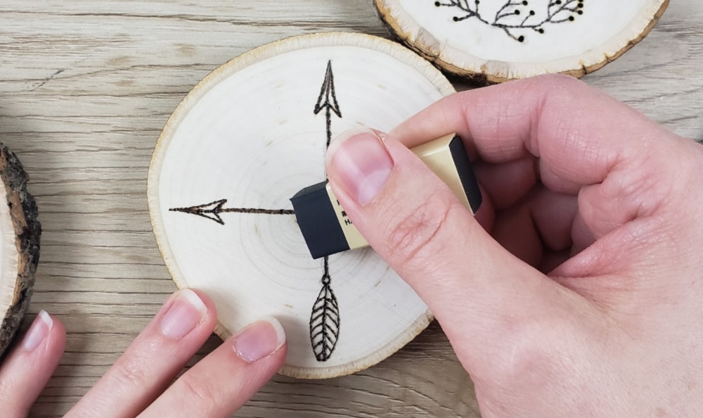 Erasing graphite lines on wood burned coasters