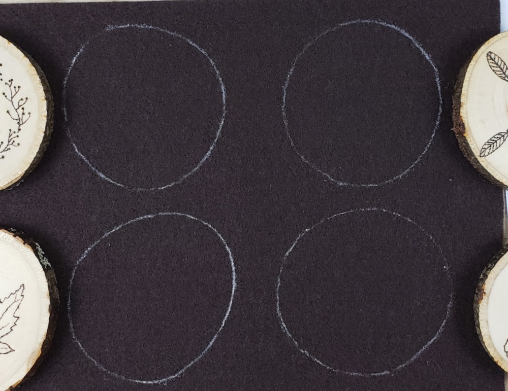 Felt outlines drawn for wood burning coasters