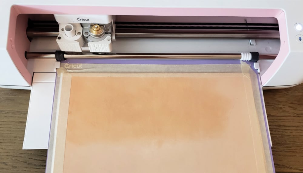 Loading the leather into the Cricut Maker