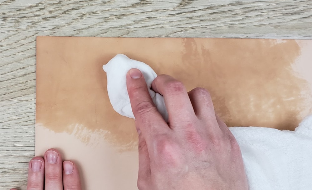 Dampening the leather before making DIY Leather Bookmarks with the Cricut Maker