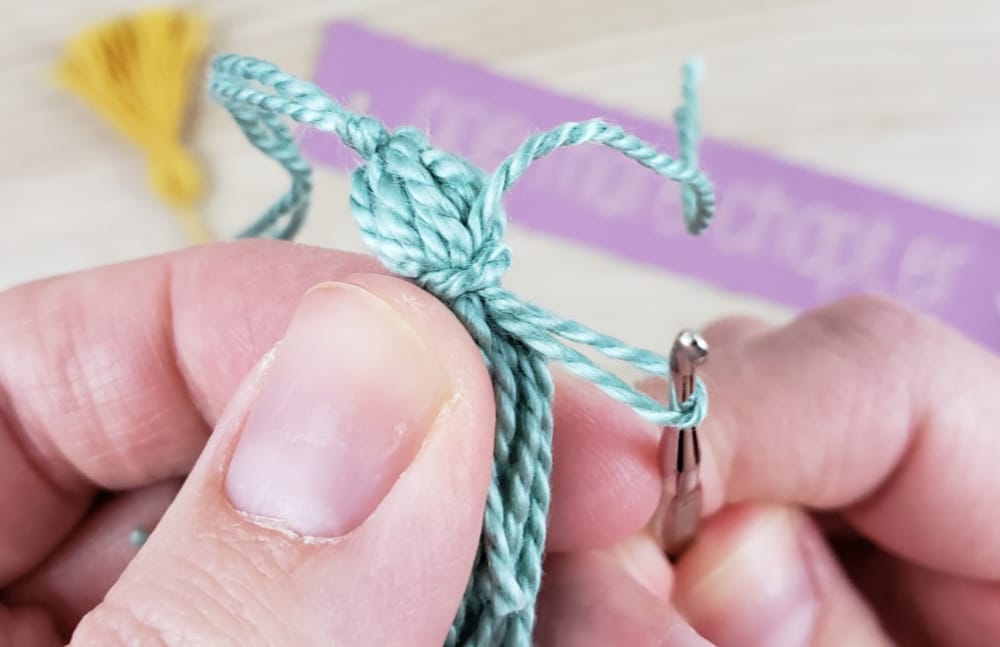 Using crochet hook to hide ends on DIY Tassel