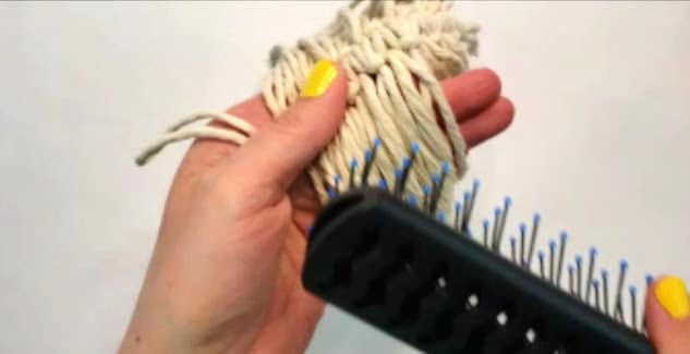 Brush out the fringe on the feather