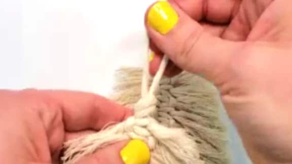 Tie an overhand knot on the hanger