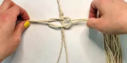 Lay the second piece of rope on top of the first facing the other way | macrame feather tutorial