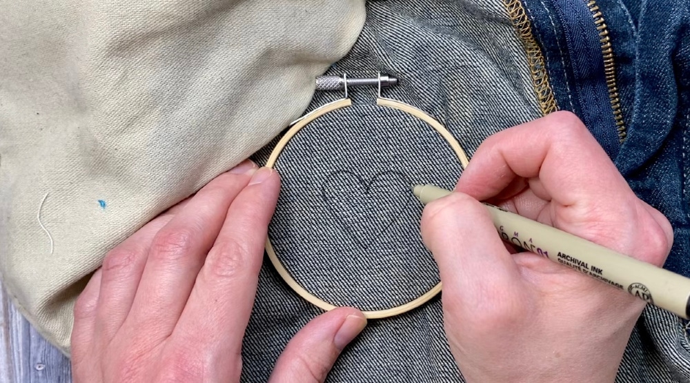 Draw the punch needle design on the denim