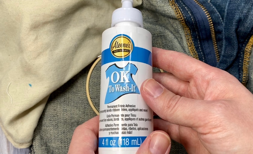 Fabric glue to put on the back of the punch needle so it can be washed