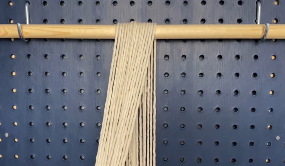 drape cords over the dowel