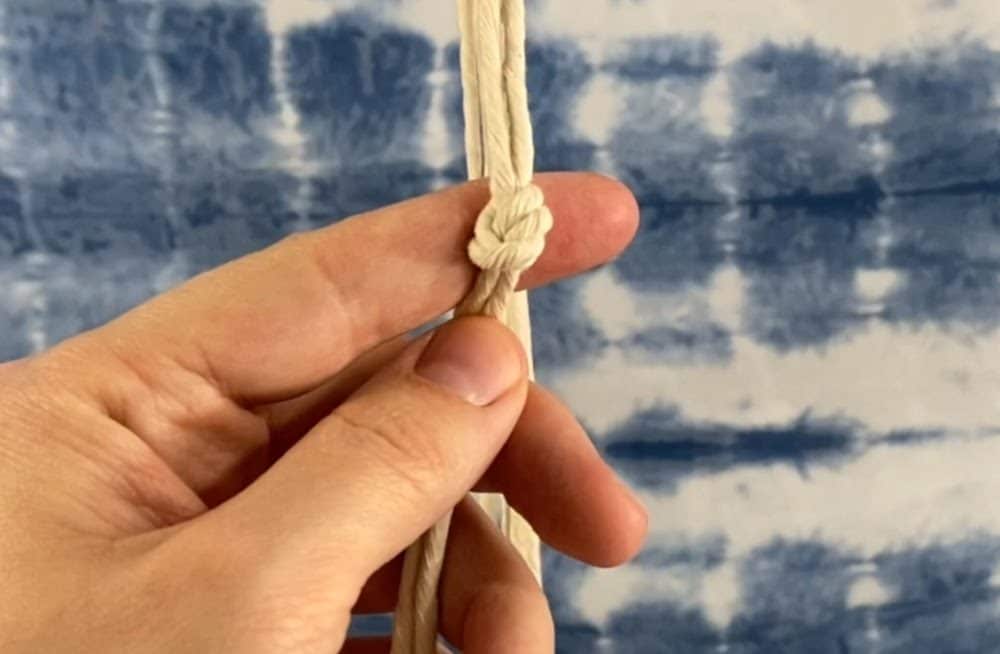 tie the first row of overhand knots