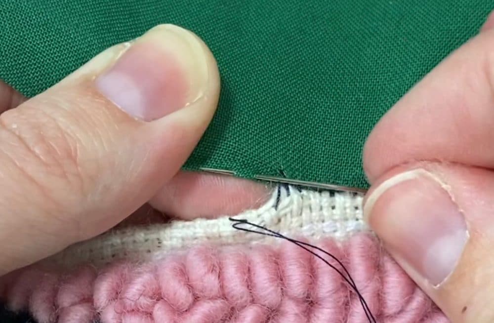 sewing a ladder stitch to close the pillow