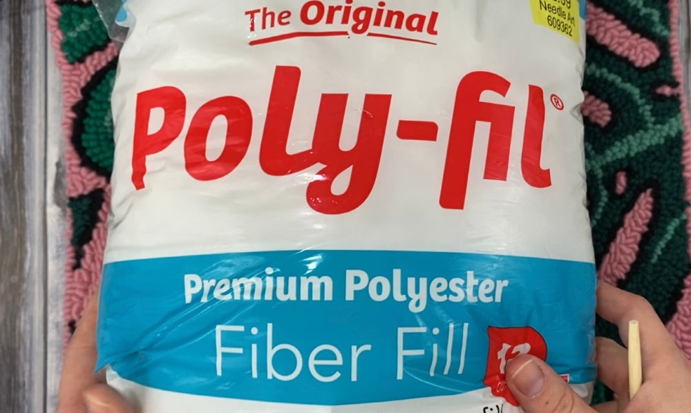 time to add stuffing to our punch needle pillow