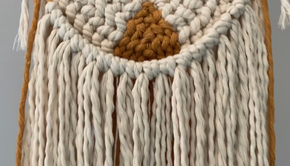 Added fringe on the back of the DIY macrame wall hanging