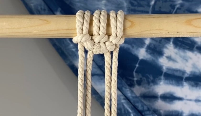 First row of DIY macrame wall hanging complete
