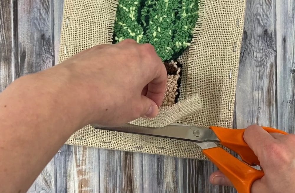 Trim the excess fabric | finishing punch needle projects