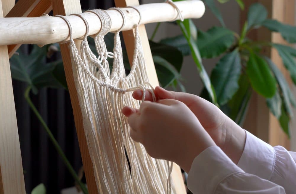 person doing macrame