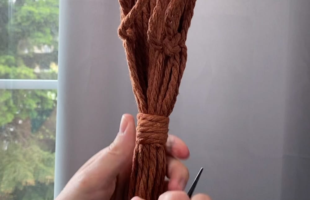 Tie a wrapping knot at the bottom | macrame plant hanger diy