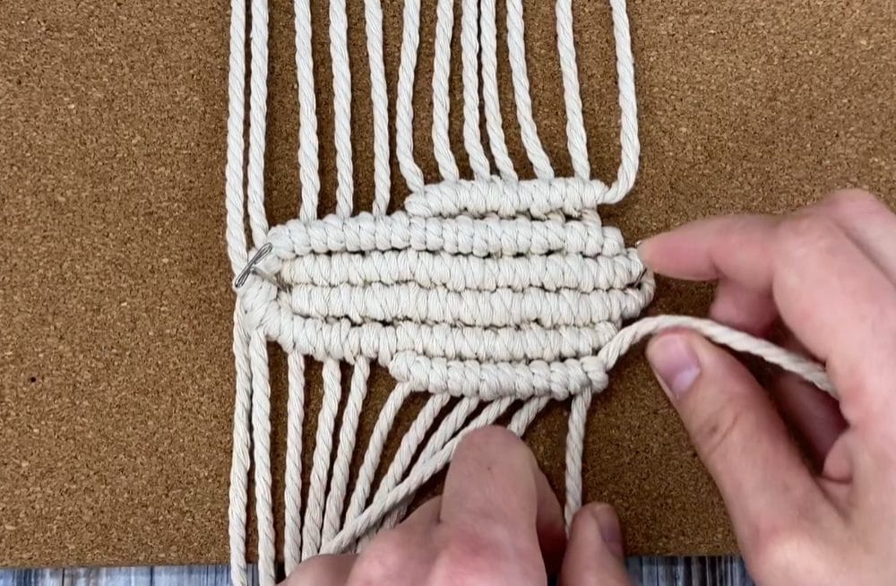 repeat reverse row of double half hitch knots on the other side of macrame flower