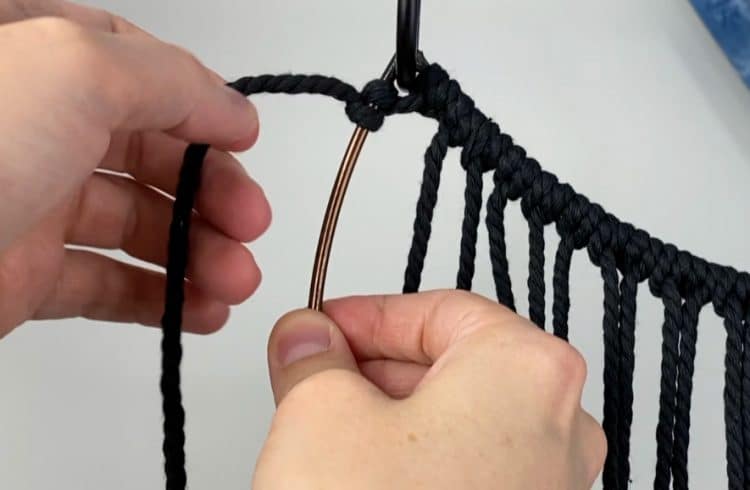 Attach first cord to the frame with a double half hitch knot | macrame moon dreamcatcher