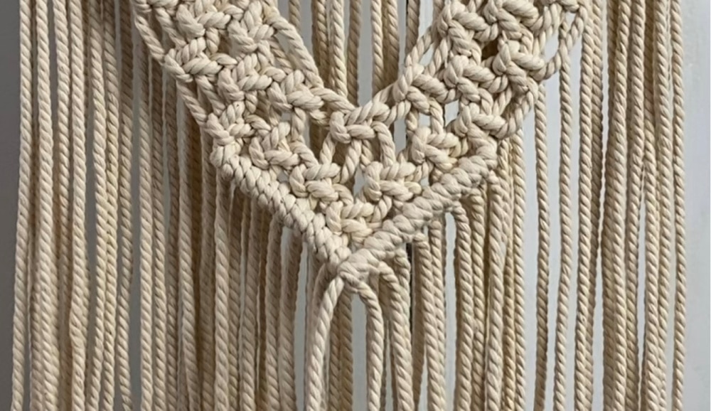 Tie a row of double half hitch knots  | DIY Macrame Wall Hanging Tutorial