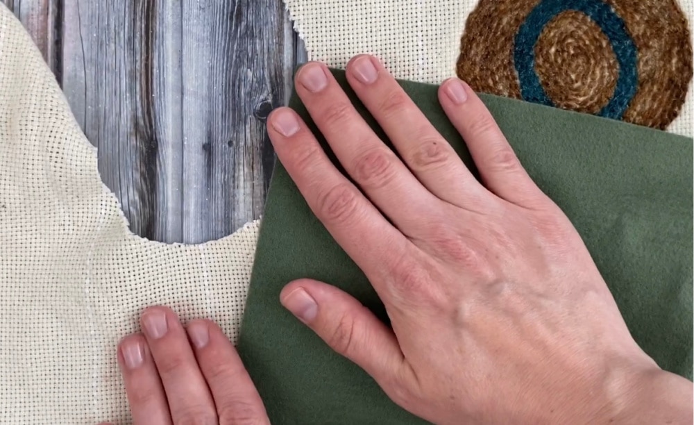 adding wool felt to the back of the punch needle coasters
