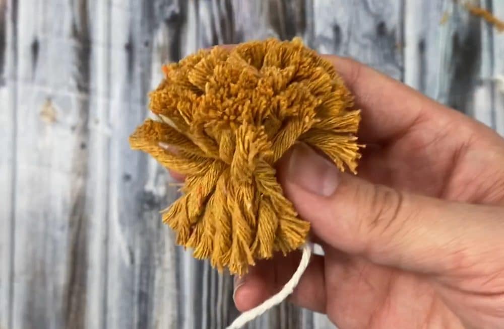 making pom poms with a clover pom pom maker | DIY macrame fall wreath