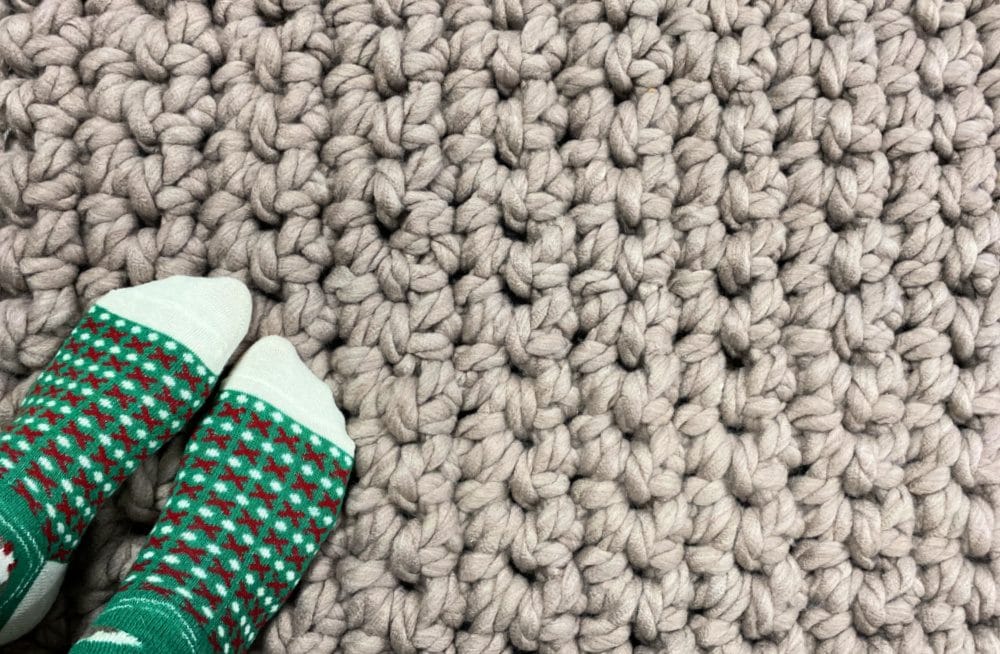 me standing on my super bulky crochet rug