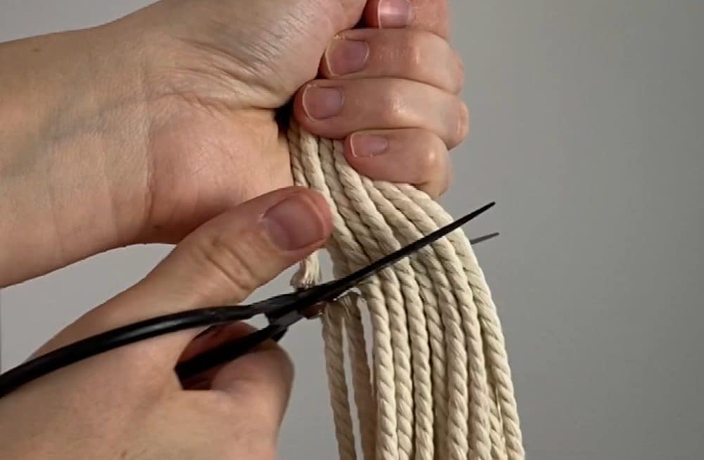 cut the fringe on the macrame wine tote