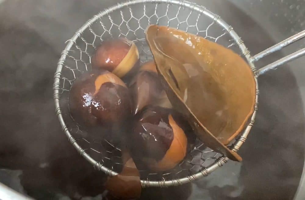 removing the pits and peels from the avocado dye bath