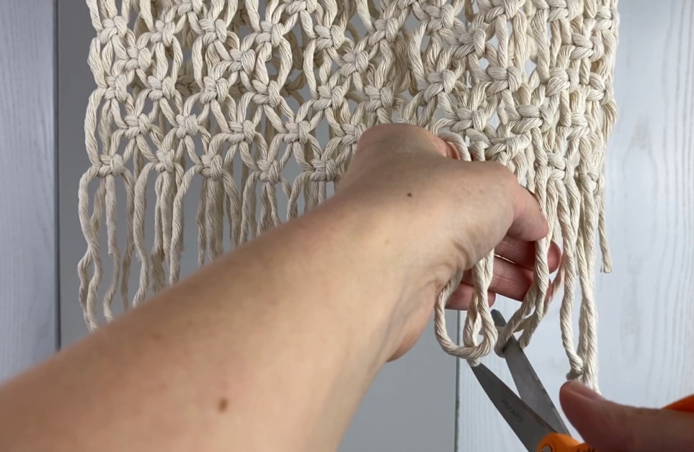 cutting the hanging loops open for fringe