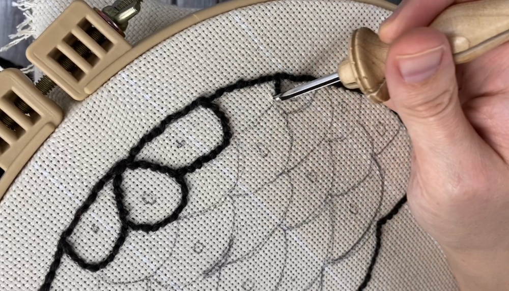 punching the outlines of the acorn trivet