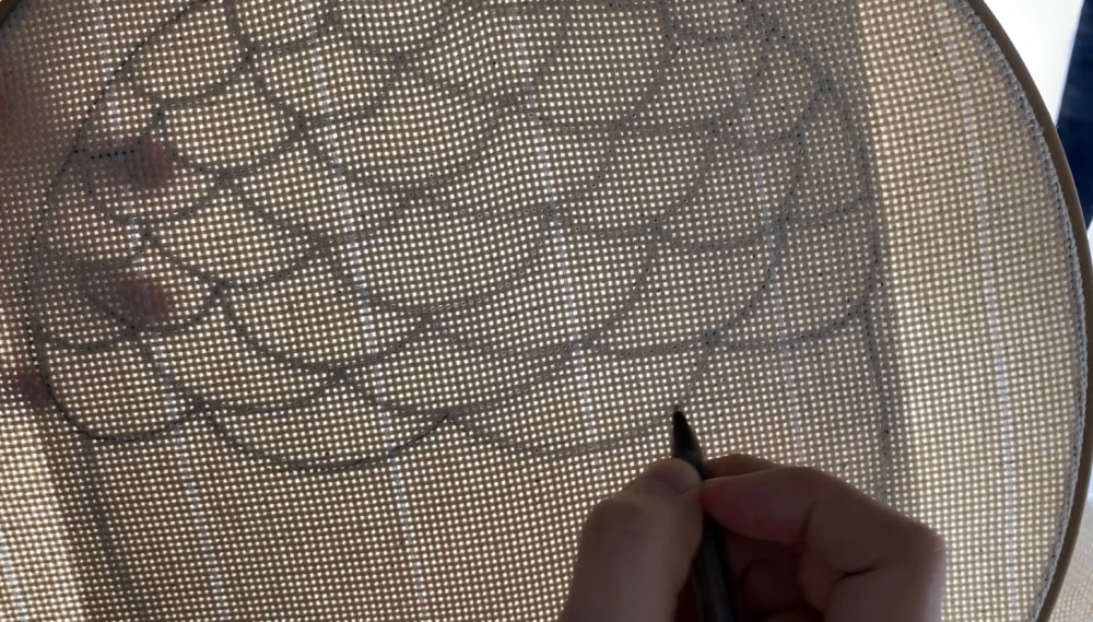 tracing the punch needle pattern for acorn trivet